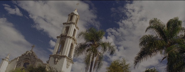 Wide shot frame from La La Land — tower, palm tree