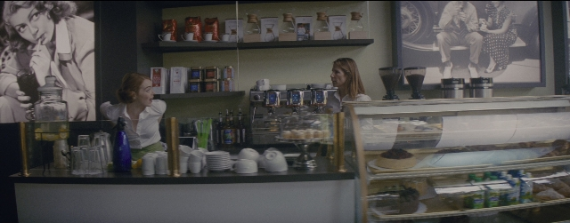 Wide shot frame from La La Land — standing, dialogue, shirt