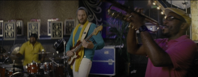 Wide shot frame from La La Land — room, hat, shirt