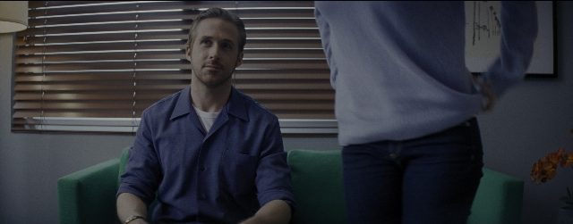 Wide shot frame from La La Land — sitting, standing, room