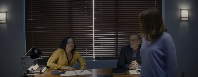 Wide shot frame from La La Land — sitting, table, dialogue