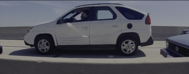 Wide shot frame from La La Land — door, car, wheel