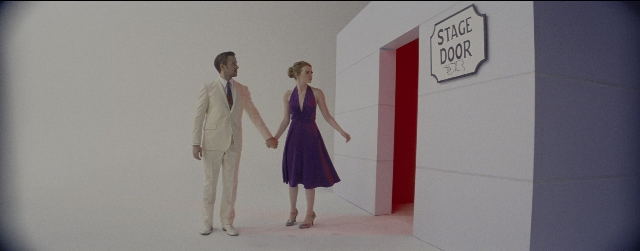Wide shot frame from La La Land — walking, room, door