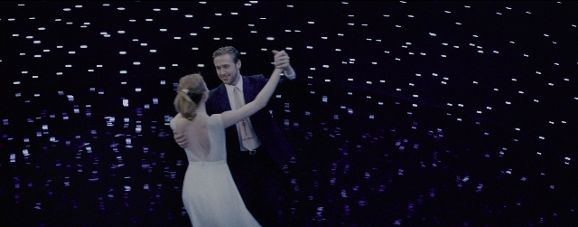 Wide shot frame from La La Land — standing, dress, person