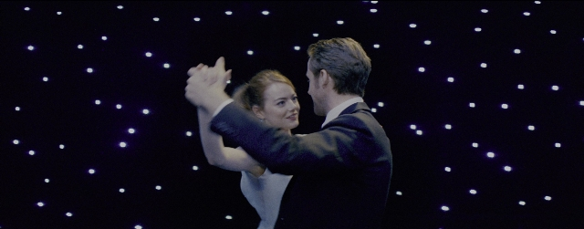 Wide shot frame from La La Land — suit, night, dress
