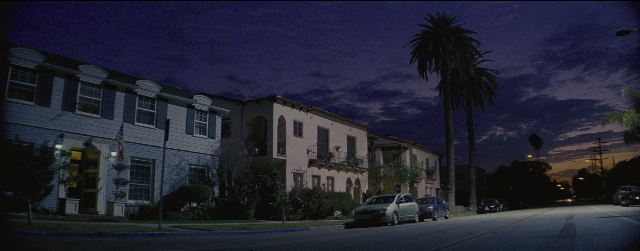 Wide shot frame from La La Land — street, car, night