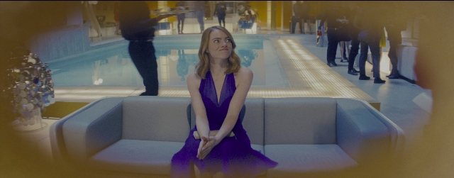 Wide shot frame from La La Land — sitting, walking, mirror
