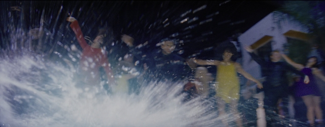 Wide shot frame from La La Land — standing, water, person