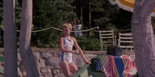 Wide shot frame from Magnificent Obsession — standing, walking, face