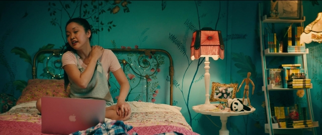 Wide shot frame from To All the Boys I've Loved Before — sitting, room, table