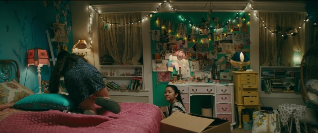 Wide shot frame from To All the Boys I've Loved Before — sitting, room, bed
