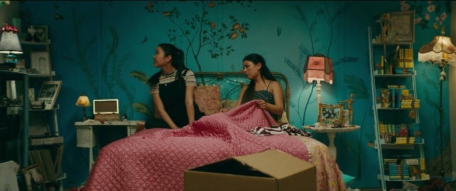 Wide shot frame from To All the Boys I've Loved Before — sitting, room, dialogue