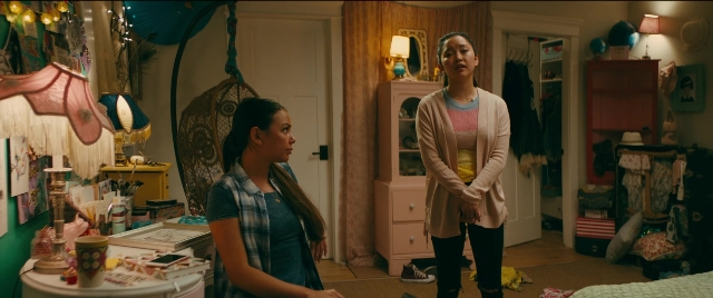 Wide shot frame from To All the Boys I've Loved Before — standing, room, table