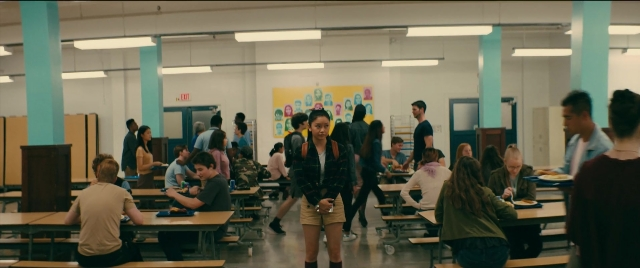 Wide shot frame from To All the Boys I've Loved Before — sitting, standing, room