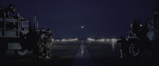 Wide shot frame from Air Force One — sitting, night, wheel