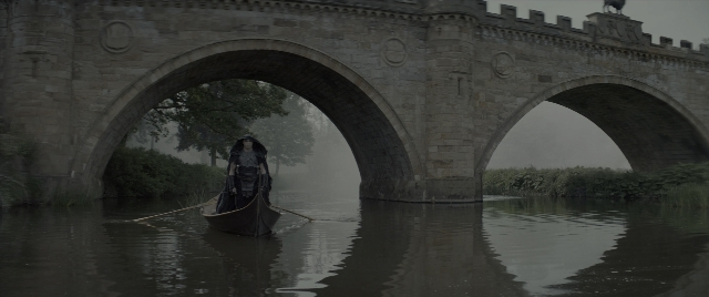 Wide shot frame from Dungeons & Dragons: Honor Among Thieves — hat, coat, water