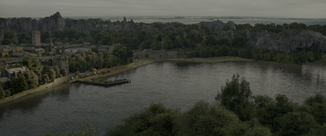 Wide shot frame from Dungeons & Dragons: Honor Among Thieves — water, castle