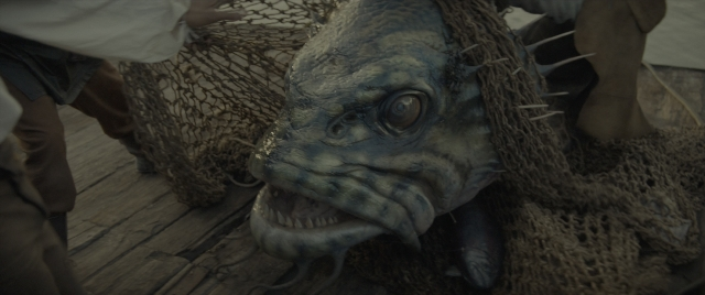 Wide shot frame from Dungeons & Dragons: Honor Among Thieves — boat, fish, person