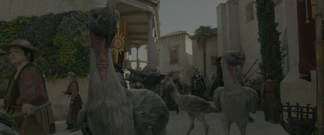 Wide shot frame from Dungeons & Dragons: Honor Among Thieves — walking, street, hat