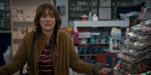 Wide shot frame from Stranger Things — standing, jacket, face