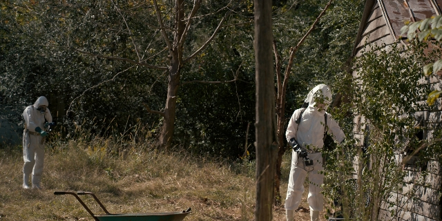 Wide shot frame from Stranger Things — standing, house, cart