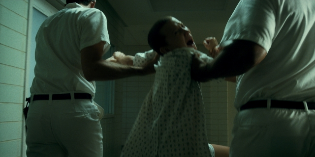Wide shot frame from Stranger Things — standing, room, person