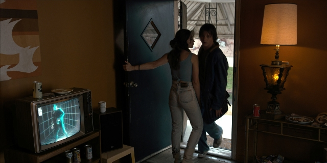 Wide shot frame from Stranger Things — standing, walking, room