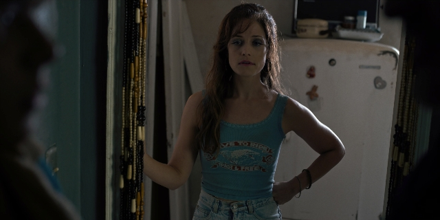 Wide shot frame from Stranger Things — standing, room, mirror