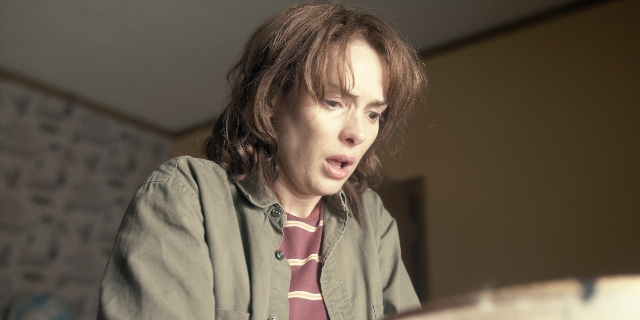 Wide shot frame from Stranger Things — room, dialogue, shirt