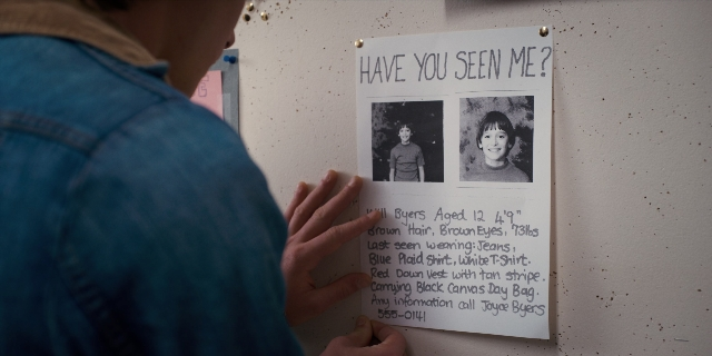 Wide shot frame from Stranger Things — standing, room, face