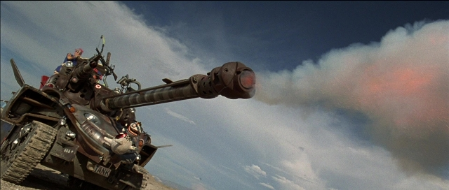 Frame from Tank Girl — gun, tank, smoke