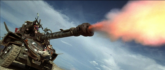 Frame from Tank Girl — gun, tank, smoke