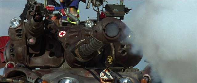 Frame from Tank Girl — face, smoke, smiling