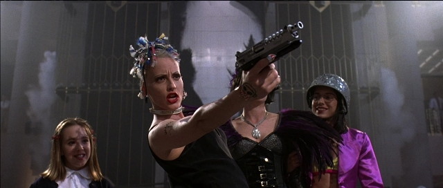 Wide shot frame from Tank Girl — hat, hand, hair
