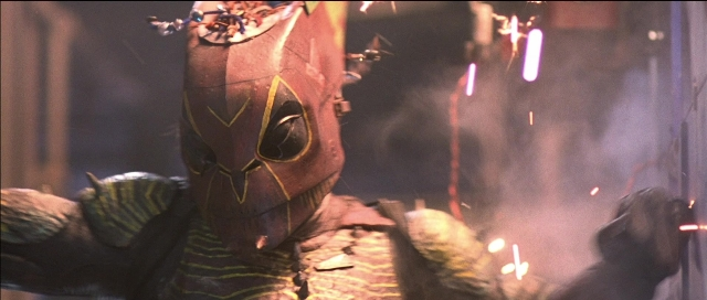 Frame from Tank Girl — face, smoke, person
