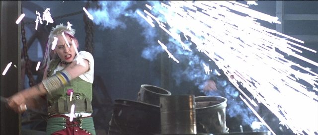 Frame from Tank Girl — standing, hair, smoke