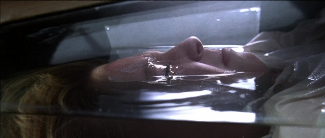 Wide shot frame from Tank Girl — water, face, person
