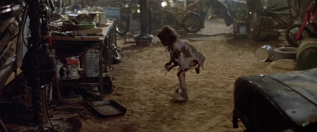Frame from Mad Max 2 — dog, person, running