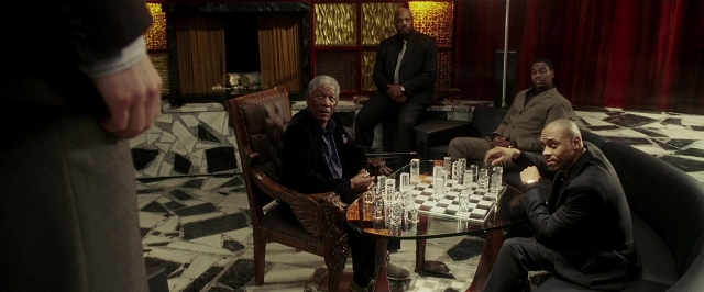 Medium shot frame from Lucky Number Slevin — people, sitting, action