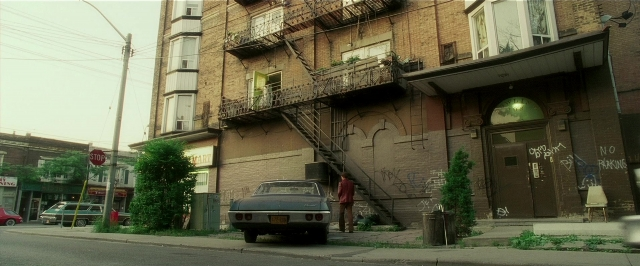 Wide shot frame from Lucky Number Slevin — walking, street, fire