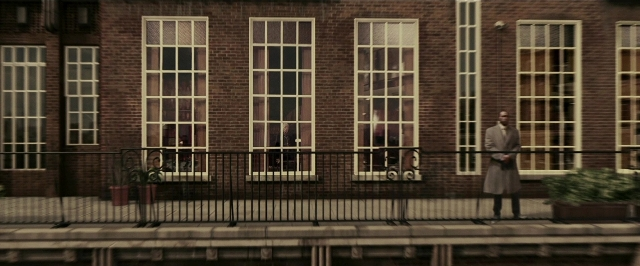 Wide shot frame from Lucky Number Slevin — standing, street, suit