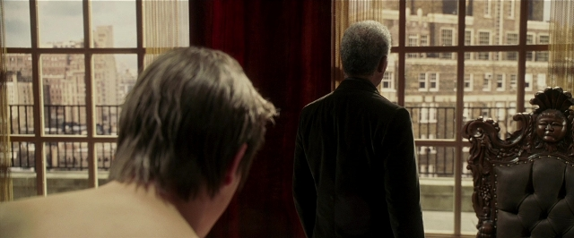 Wide shot frame from Lucky Number Slevin — standing, suit, water