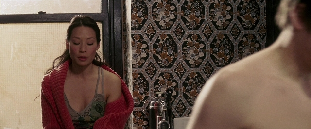 Wide shot frame from Lucky Number Slevin — standing, mirror, bathroom