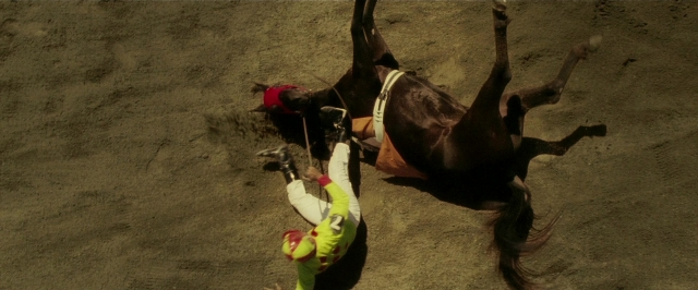 Wide shot frame from Lucky Number Slevin — hat, shirt, horse