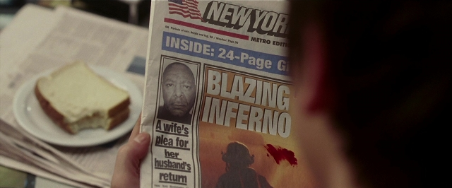 Wide shot frame from Lucky Number Slevin — plate, table, hand