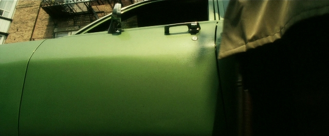 Wide shot frame from Lucky Number Slevin — door, car, window