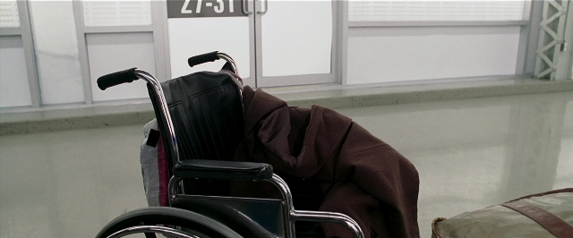 Frame from Lucky Number Slevin — bag, wheelchair