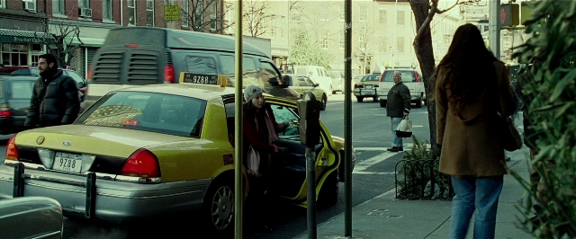 Wide shot frame from Lucky Number Slevin — walking, plate, street