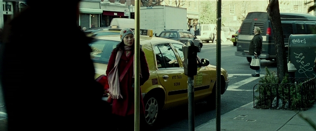 Wide shot frame from Lucky Number Slevin — standing, walking, street