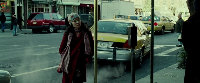Wide shot frame from Lucky Number Slevin — walking, street, car
